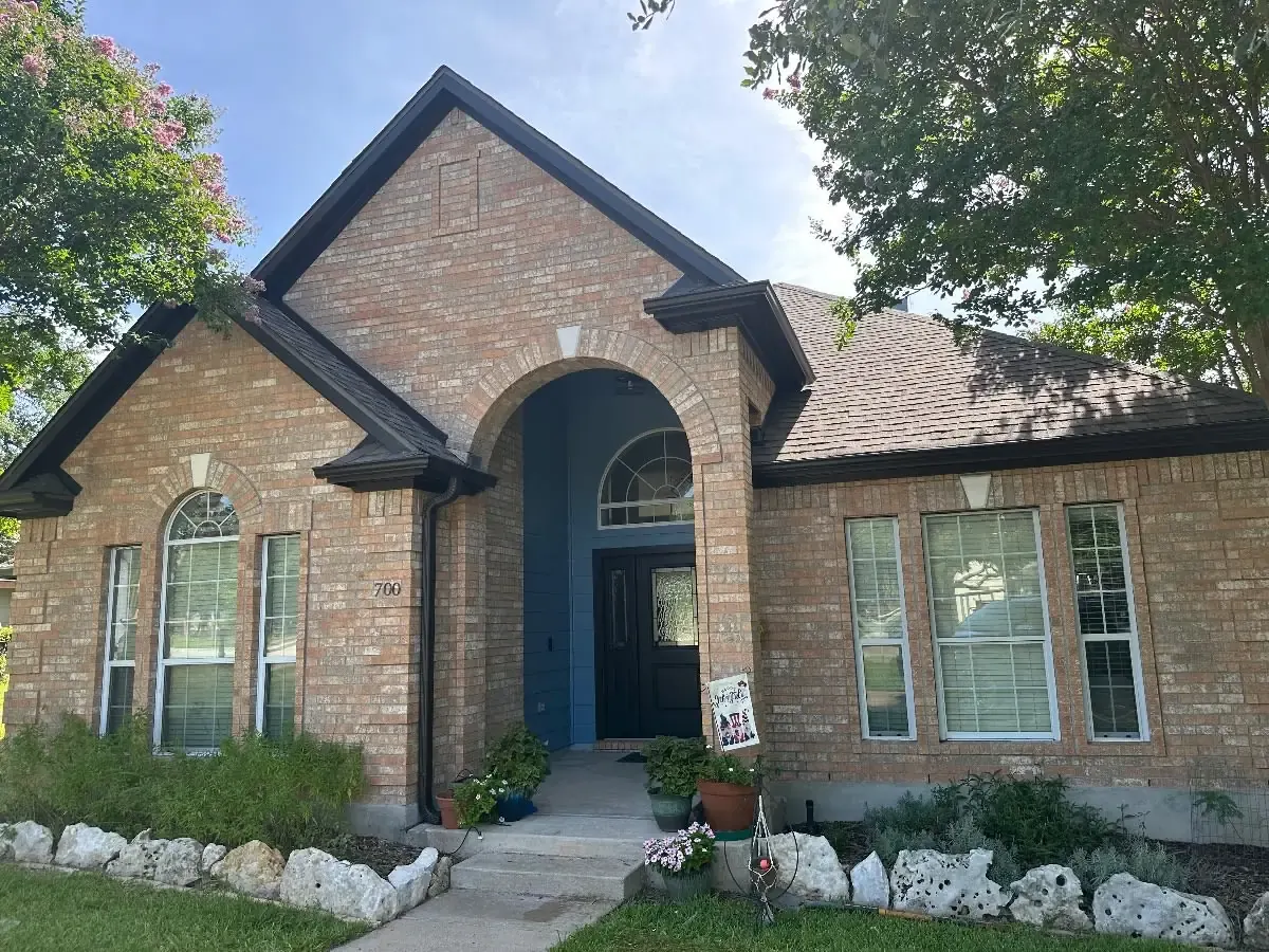 Brick Arched Entry & Dark Trim