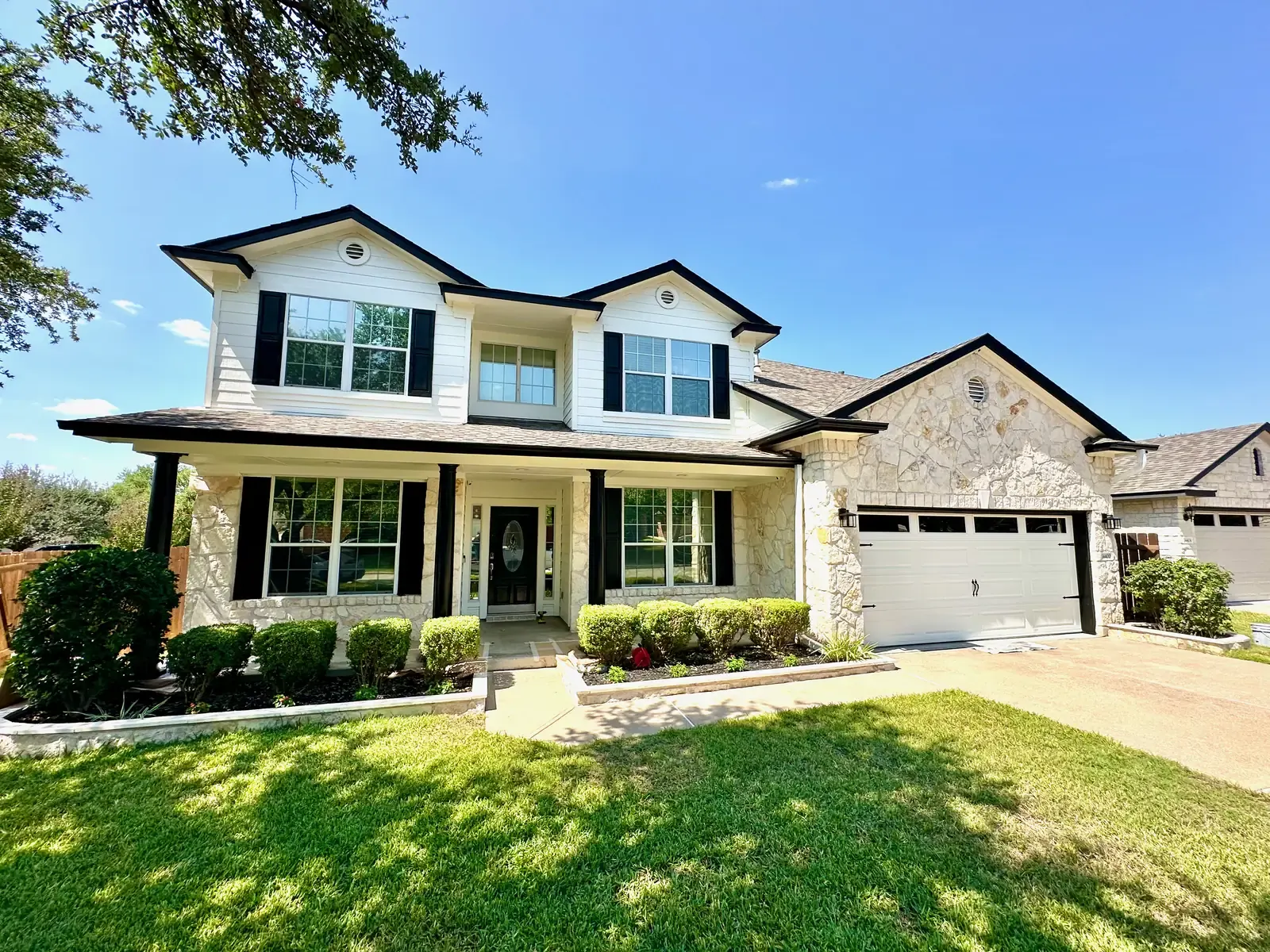 Exterior white stone two-story house