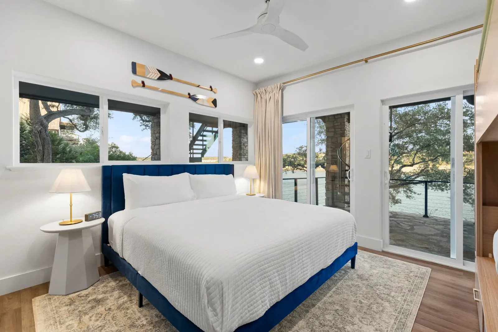 Interior white lakeview bedroom with navy bed